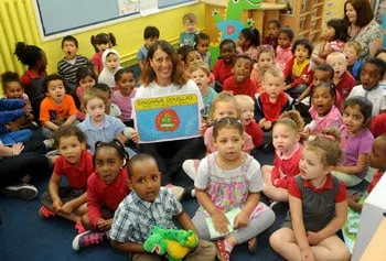 Heather Maisner reading to children at a Dinosaur Douglas launch